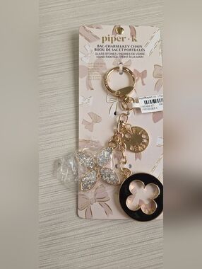 Piper Gold-Tone Floral Crystal Bag Charm with Black Enamel Medallion